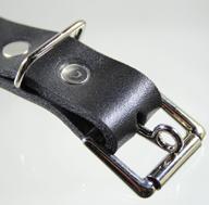 A heel bar locking tongue roller buckle in use.