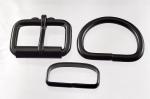 Two 1 1/2 inch black plated roller buckles, two <I>deluxe</I>
  belt keepers, and two D rings